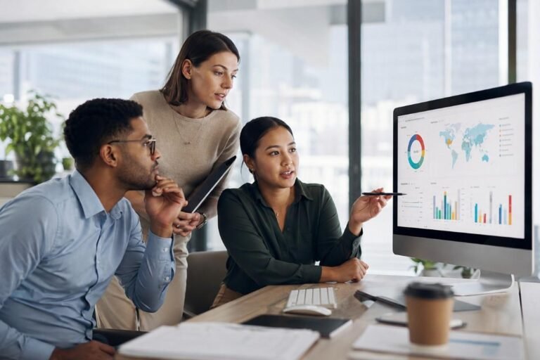 Team using AI in market research to analyze consumer data on screen
